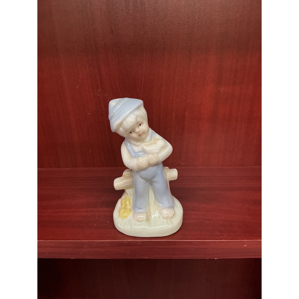Vintage Porcelain Boy Figurine Blue Overalls Sitting on Fence Charming Collect‎